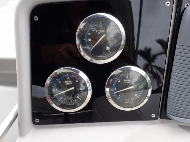 Slide: The Image of Dashboard gauges of a 2007 Formula 34 PC boat, showing speed and RPM. - 10