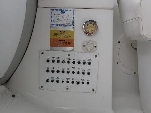 Slide: The Image of Control panel of a 2007 Formula 34 PC boat with switches and gauges. - 11
