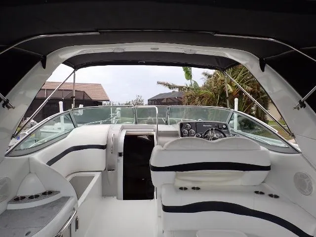 Slide: The Image of Interior view of 2007 Formula 34 PC yacht, featuring sleek seating and modern dashboard. - 12