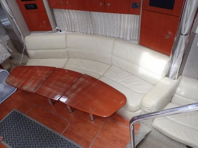 Slide: The Image of Luxurious interior of 2007 Formula 34 PC yacht with cream leather seating and wooden table. - 13