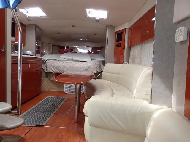 Slide: The Image of Luxurious interior of a 2007 Formula 34 PC yacht with leather seating and wood finishes. - 16