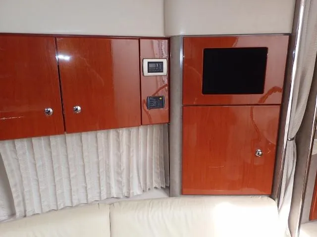 Slide: The Image of 2007 Formula 34 PC interior with glossy wood cabinets and control panels. - 19