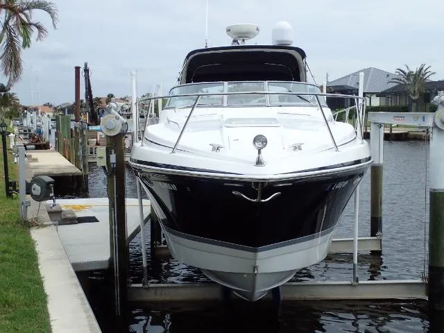 Slide: The Image of 2007 Formula 34 PC boat docked on a lift in a marina. - 2