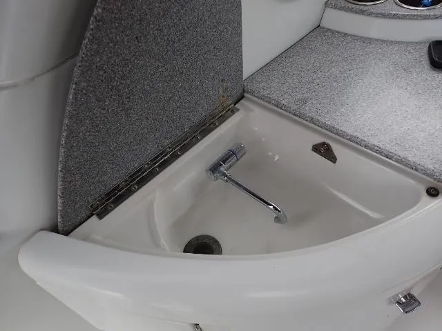 Slide: The Image of 2007 Formula 34 PC boat sink with faucet and countertop. - 27
