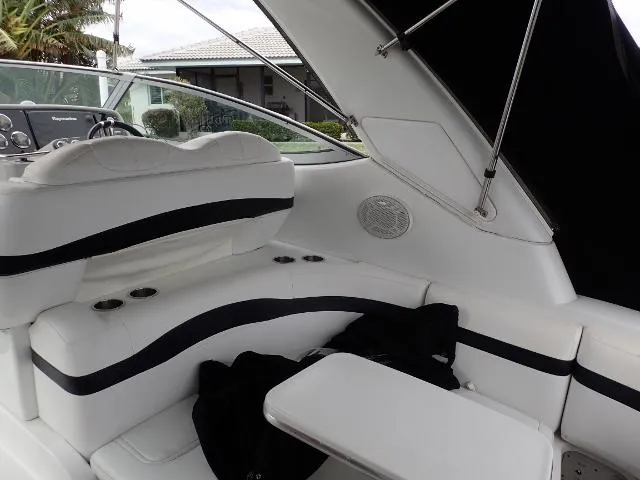 Slide: The Image of 2007 Formula 34 PC boat interior with white seating and black accents. - 29