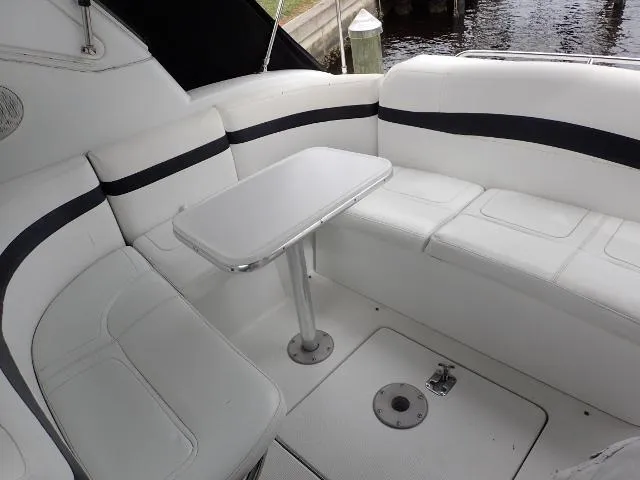 Slide: The Image of 2007 Formula 34 PC boat interior with white seating and table. - 30