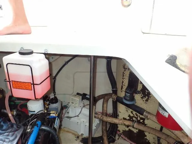 Slide: The Image of Engine compartment of 2007 Formula 34 PC boat with visible coolant reservoir. - 35