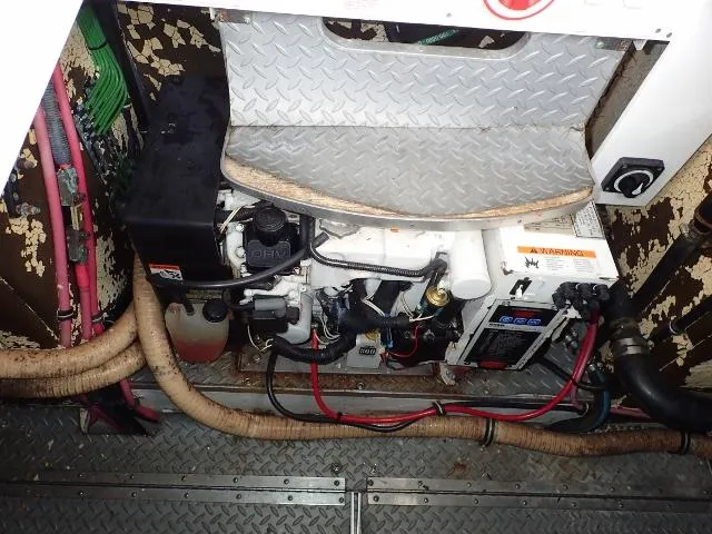 Slide: The Image of Engine compartment of 2007 Formula 34 PC boat with visible wiring and components. - 39