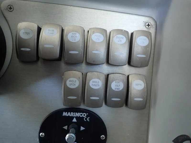 Slide: The Image of Control panel of a 2007 Formula 34 PC boat with labeled switches. - 40