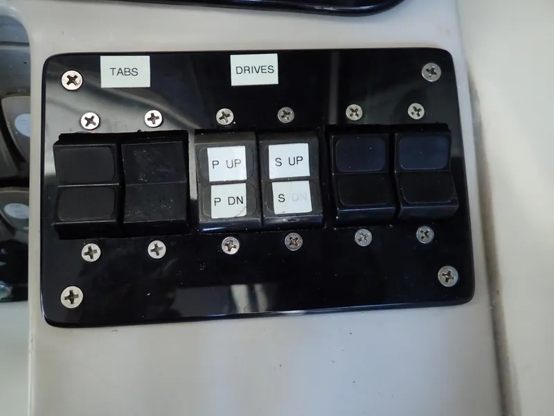 Slide: The Image of Control panel of a 2007 Formula 34 PC boat with labeled switches. - 41