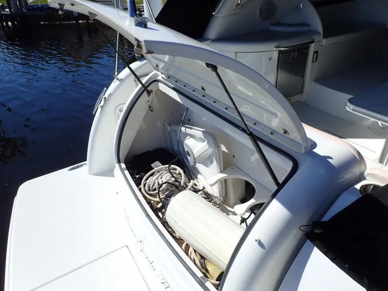 Slide: The Image of 2007 Formula 34 PC boat storage compartment with open hatch, showing ropes and equipment. - 43