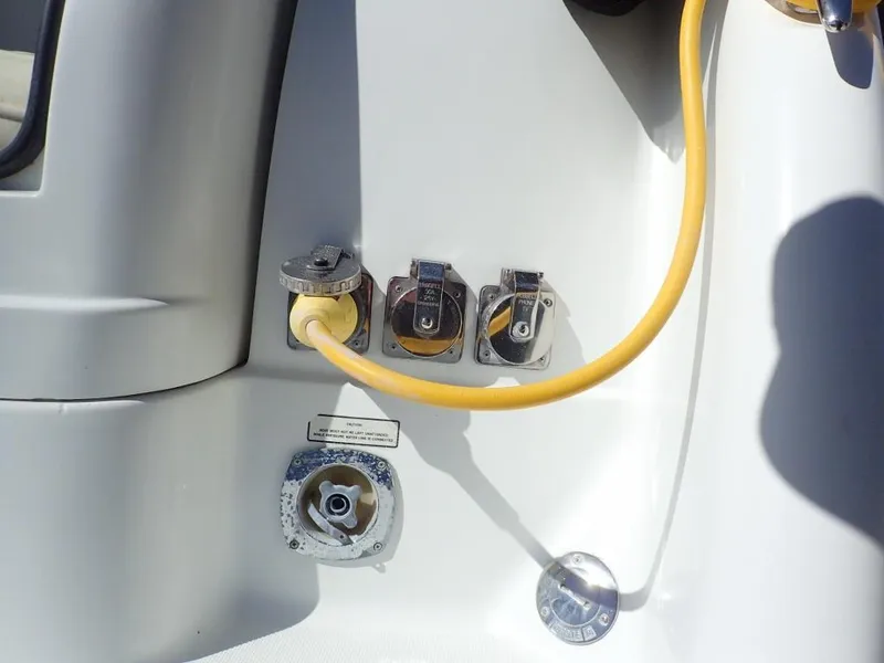 Slide: The Image of 2007 Formula 34 PC boat power connections with yellow cable. - 45