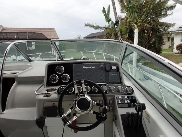 Slide: The Image of 2007 Formula 34 PC boat dashboard with steering wheel and navigation controls. - 7