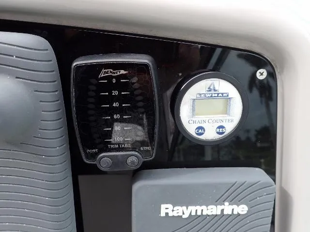 Slide: The Image of Raymarine and Lewmar controls on 2007 Formula 34 PC boat dashboard. - 9