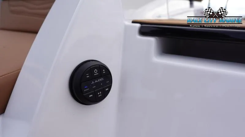 Slide: The Image of 2025 Nautique Super Air Nautique G25 audio control panel on white interior. - 15