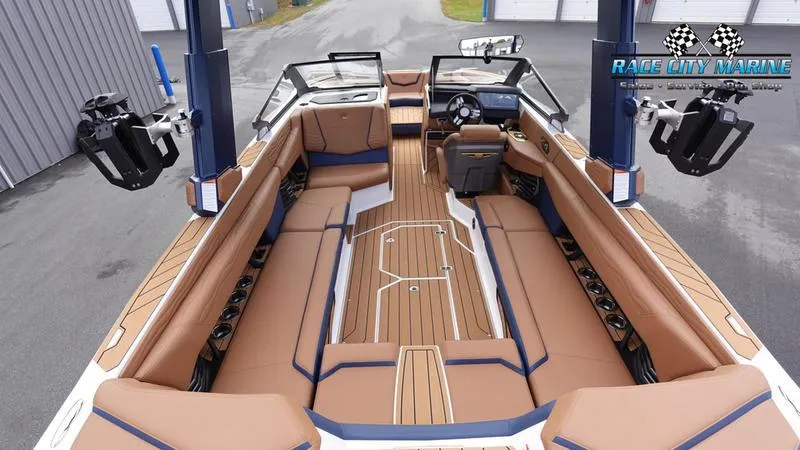 Slide: The Image of 2025 Nautique Super Air Nautique G25 interior with luxurious seating and advanced controls. - 16
