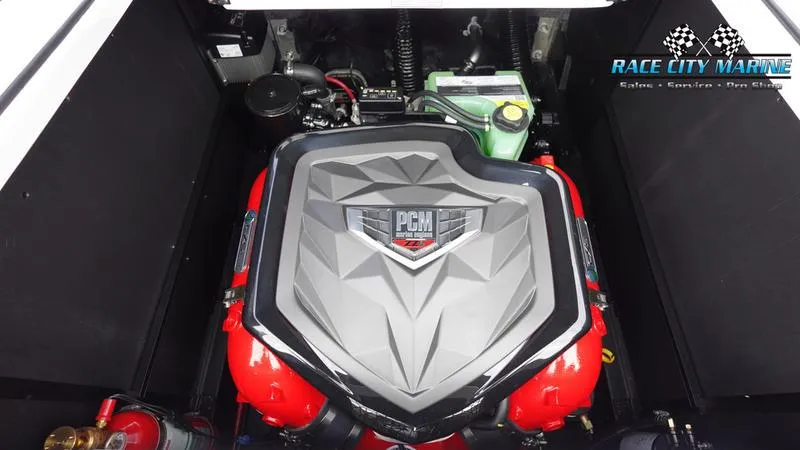 Slide: The Image of 2025 Nautique Super Air Nautique G25 engine compartment with PCM engine, Race City Marine branding. - 19