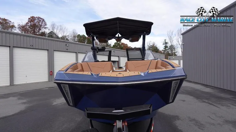 Slide: The Image of 2025 Nautique Super Air Nautique G25 boat in a storage facility. - 3