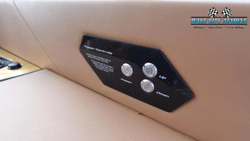 Slide: The Image of 2025 Nautique Super Air Nautique G25 tower controls on tan interior panel. - 35