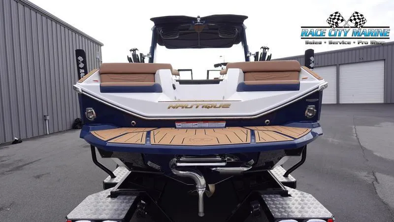 Slide: The Image of 2025 Nautique Super Air Nautique G25 boat, rear view, at Race City Marine dealership. - 4