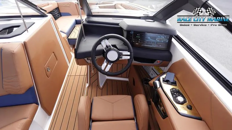 Slide: The Image of 2025 Nautique Super Air Nautique G25 interior with modern dashboard and luxurious seating. - 44