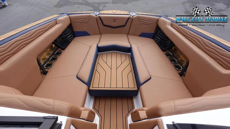 Slide: The Image of Luxurious interior of 2025 Nautique Super Air Nautique G25 boat with tan seating. - 45