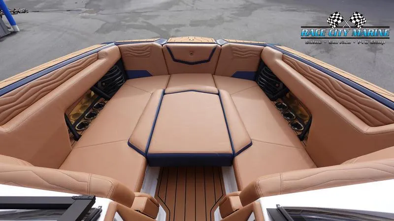 Slide: The Image of 2025 Nautique Super Air Nautique G25 boat interior with tan leather seating. - 46