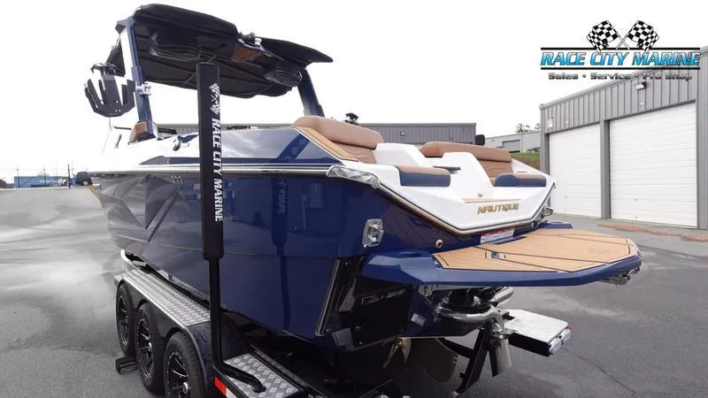 Slide: The Image of 2025 Nautique Super Air Nautique G25 boat on trailer at Race City Marine. - 7