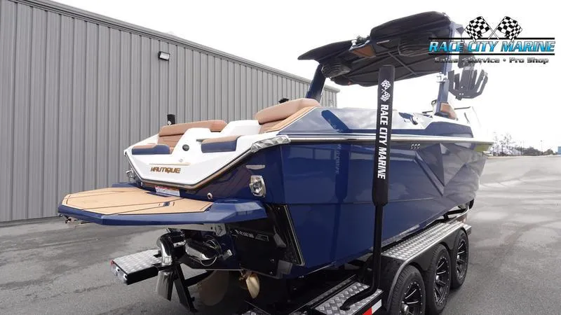 Slide: The Image of 2025 Nautique Super Air Nautique G25 boat on trailer at Race City Marine. - 8