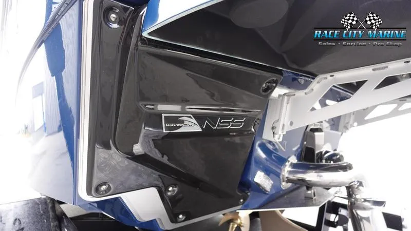 Slide: The Image of 2025 Nautique Super Air Nautique G25 boat with NSS system, Race City Marine branding. - 9