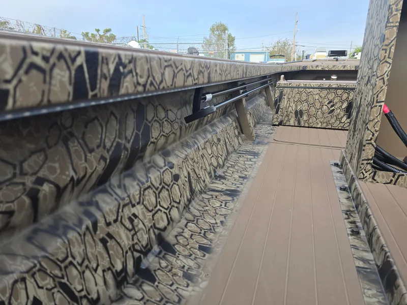 Slide: The Image of 2025 Pro-Drive 2054 X Series boat interior with camouflage pattern. - 16