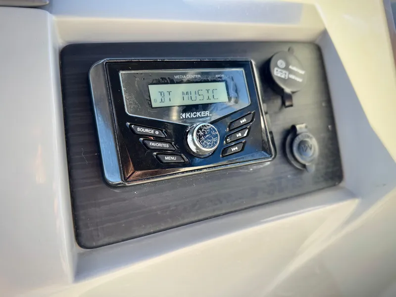 Slide: The Image of Kicker stereo system on 2021 Bennington 23 LSR boat dashboard. - 22