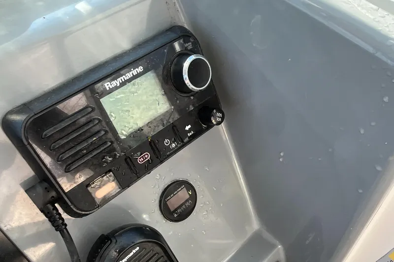 Slide: The Image of Raymarine marine radio on 2019 Striper 200 Walkaround boat dashboard. - 13