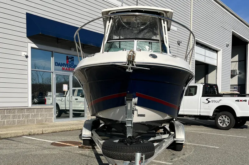 Slide: The Image of 2019 Striper 200 Walkaround boat on trailer outside dealership. - 4