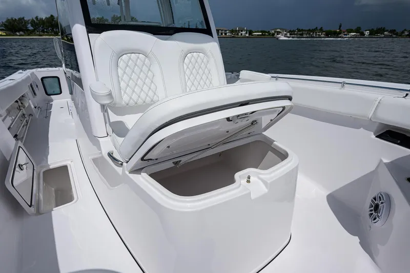 Slide: The Image of 2023 Sportsman Open 322 boat with open storage compartment on deck. - 11