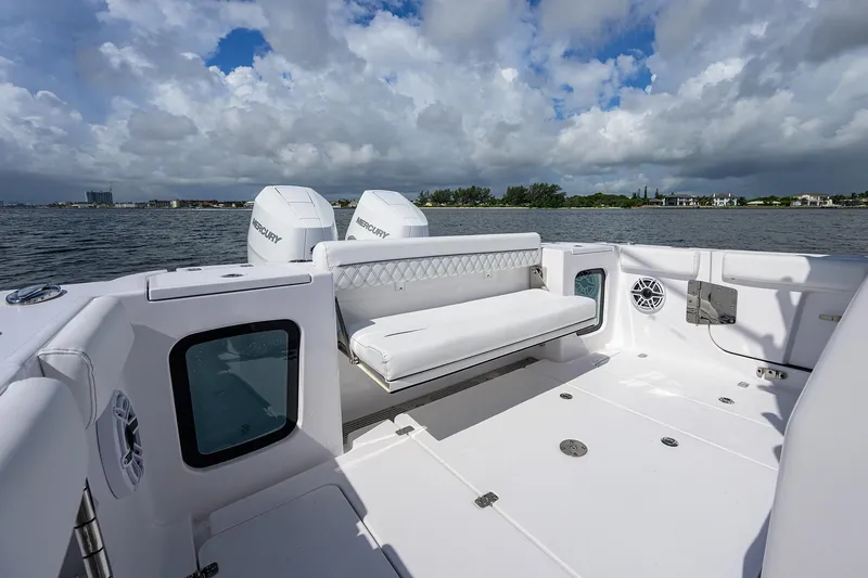 Slide: The Image of 2023 Sportsman Open 322 boat interior with seating, on a sunny day. - 19
