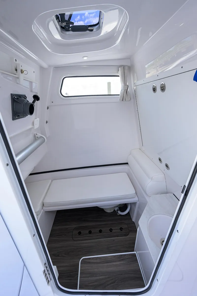 Slide: The Image of 2023 Sportsman Open 322 cabin interior with skylight and seating. - 26