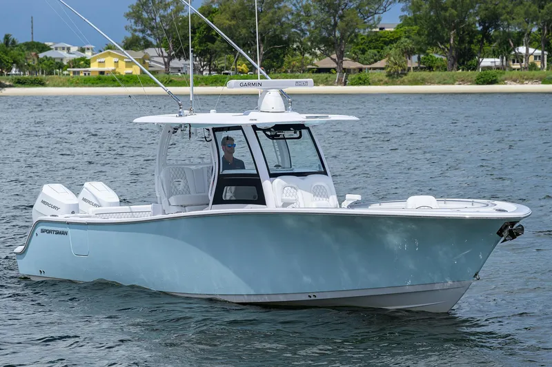 Slide: The Image of 2023 Sportsman Open 322 boat on water, featuring sleek design and modern amenities. - 3