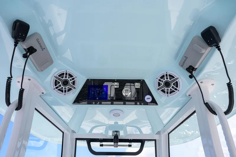 Slide: The Image of 2023 Sportsman Open 322 boat console with speakers and communication devices. - 38