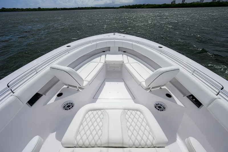 Slide: The Image of 2023 Sportsman Open 322 boat interior with white seating on open water. - 7
