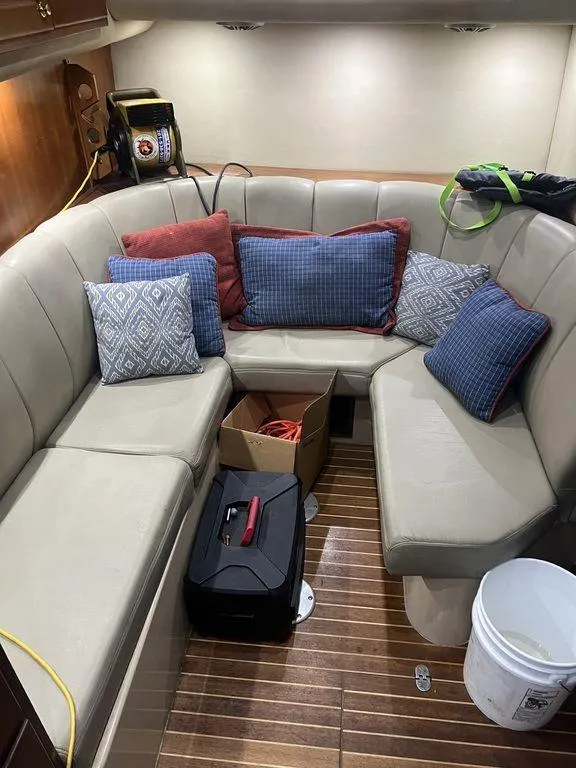 Slide: The Image of Cozy interior of 2006 Rampage 38 Express with cushioned seating and decorative pillows. - 20