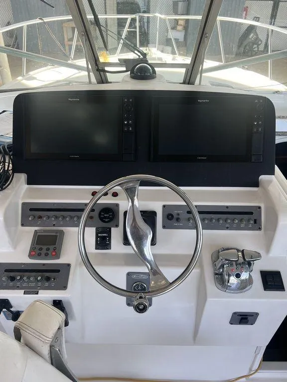 Slide: The Image of 2006 Rampage 38 Express helm with dual displays and steering wheel. - 4