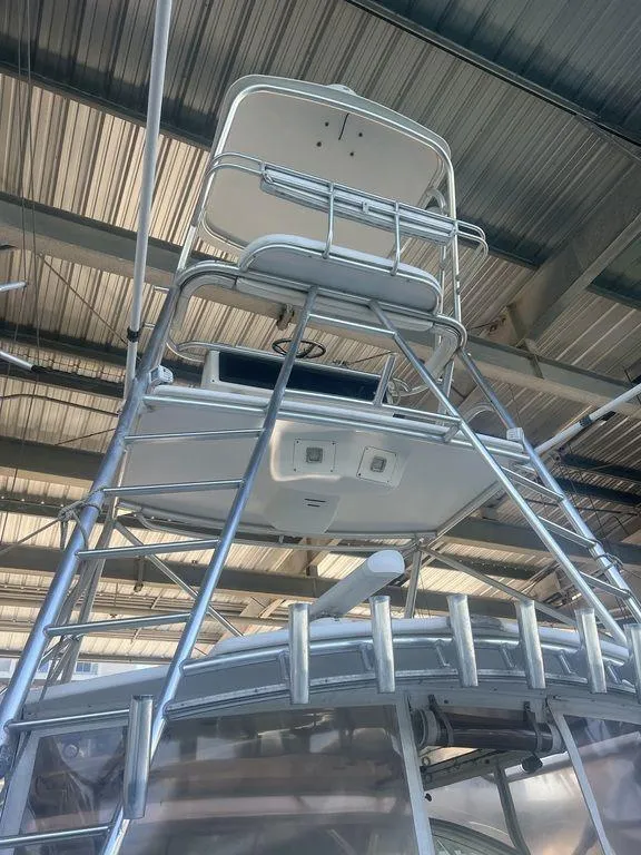 Slide: The Image of 2006 Rampage 38 Express boat tower under a metal roof. - 8