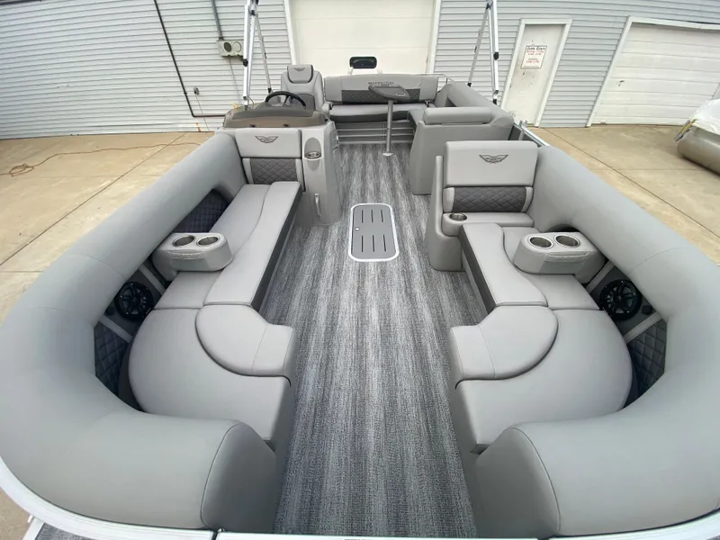 Slide: The Image of 2025 Bennington 23 LSB pontoon boat with spacious gray seating and modern design. - 10