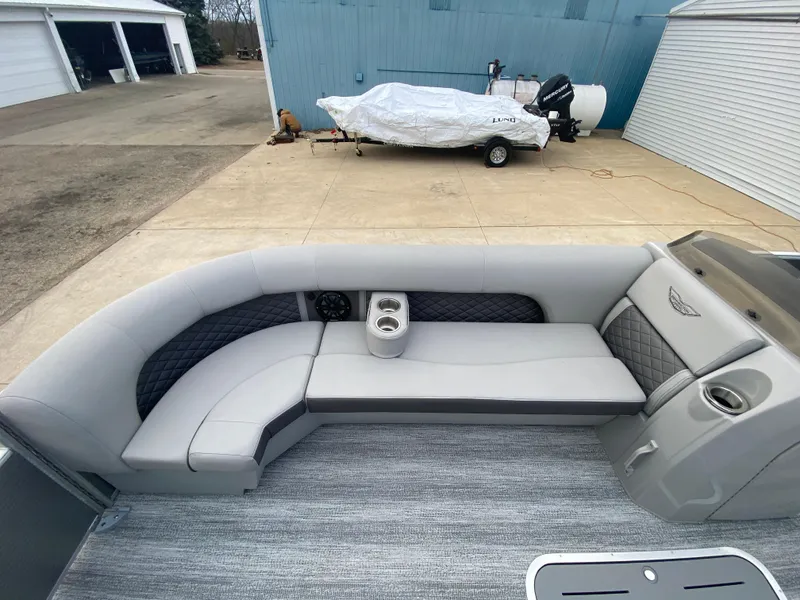 Slide: The Image of 2025 Bennington 23 LSB pontoon boat with spacious seating and modern design. - 11