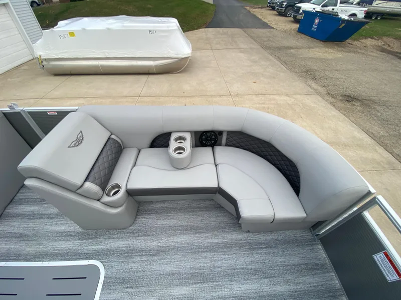 Slide: The Image of 2025 Bennington 23 LSB pontoon boat interior with gray seating and cup holders. - 13