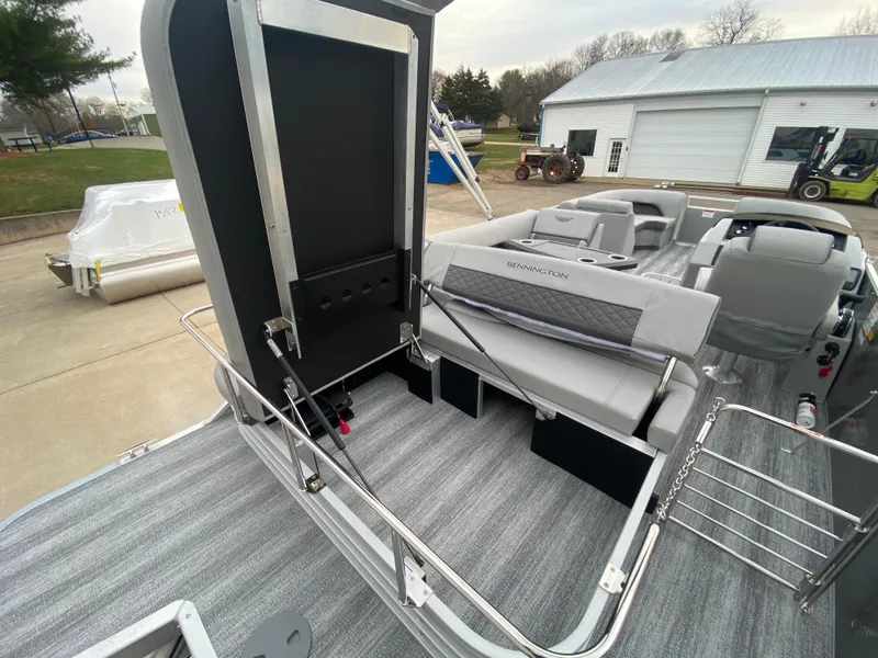 Slide: The Image of 2025 Bennington 23 LSB pontoon boat interior with gray seating and flooring. - 31