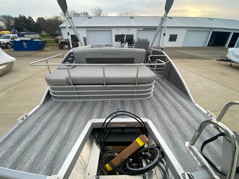 Slide: The Image of 2025 Bennington 23 LSB pontoon boat with spacious seating and modern design. - 9