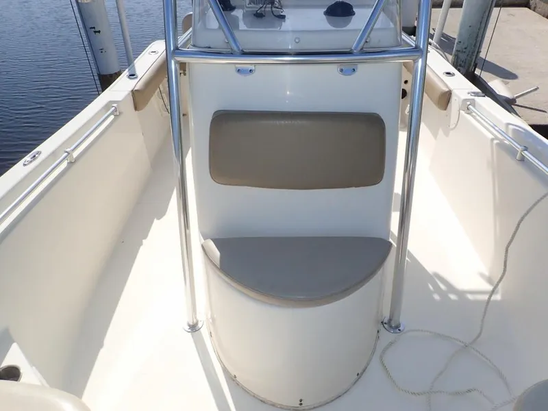 Slide: The Image of 2016 Cobia 217 Center Console boat interior with seating and railing. - 21