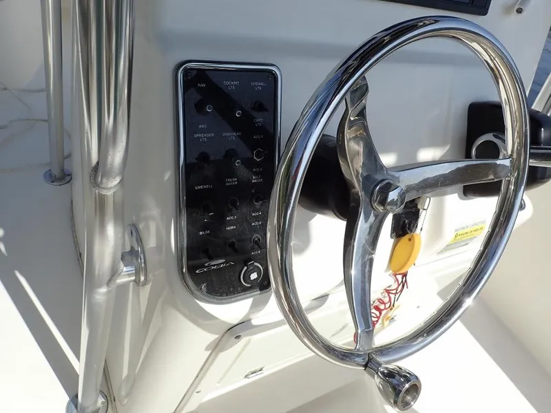 Slide: The Image of Steering wheel and control panel of 2016 Cobia 217 Center Console boat. - 29